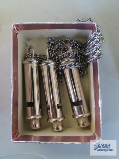 Three police whistles