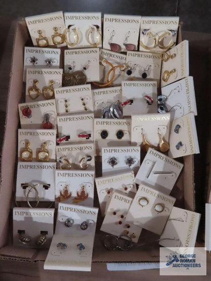 Variety of earrings made by Impressions