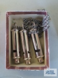 Three police whistles