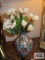 Art glass vase with floral arrangement