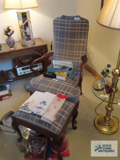 Blue plaid armchair with wooden frame and footstool