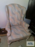 Floral print wingback chair on first floor