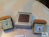 Three travel alarm clocks
