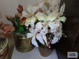 Artificial plants in brass vase and planter