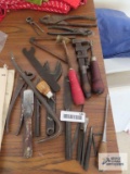 Assortment of antique tools including monkey wrench, pliers, cutters