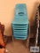 Eight light blue school chairs