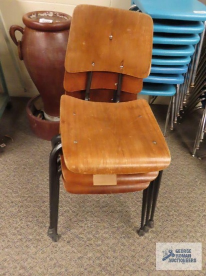 Three wooden and metal school chairs