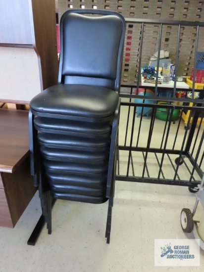 Eight commercial stacking padded chairs