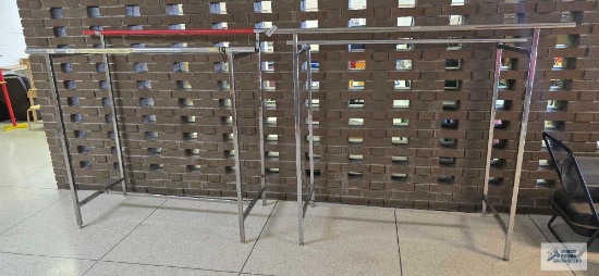 Two metal clothing racks
