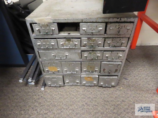 Hardware cabinet with hardware. Very heavy. Bring help and floor dolly for removal.