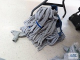 Seven blue and gray mop heads