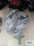 Ten green and gray mop heads