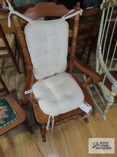 Wooden rocking chair with cushions