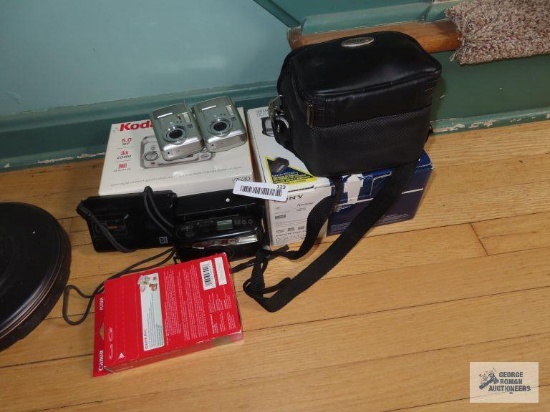Kodak cameras and Sony handicam, and photo paper