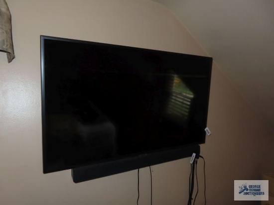 Samsung 43 inch flat screen television with remote, model UN43NU6900BXZA