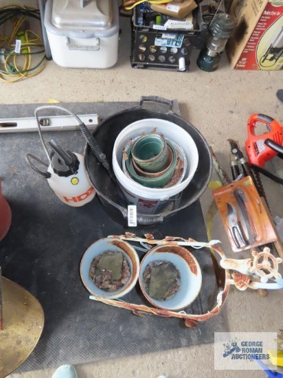 Variety of planters, bucket, decorative metal planter with faucet top, sprayer, etc