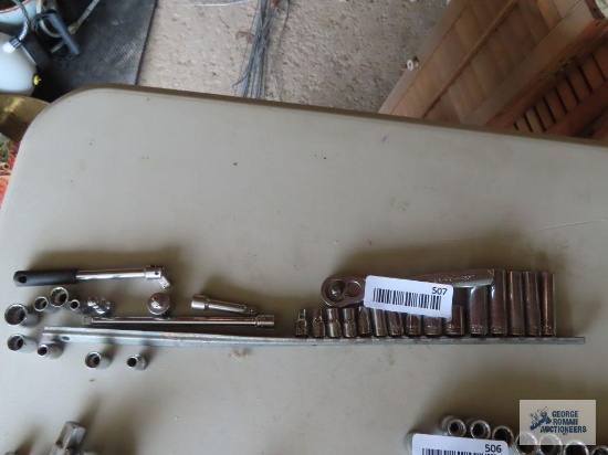 Various Craftsman 1/4 inch sockets with breaker bar, extensions and ratchet