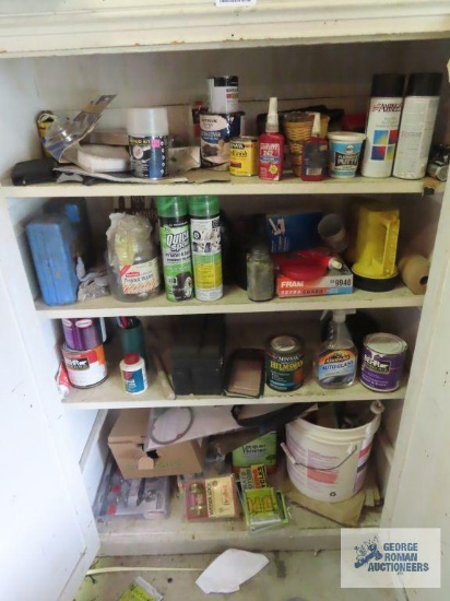 Paints, soldering gun, quick spare tire inflator and sealer, oils and etc in cabinet