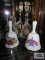 Two souvenir bells and two clear glass bells