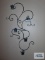Decorative candle sconce with candles. Bring philips head screwdriver for removal.