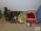 Red and gold bows, candle,florals,poinsettia, lights and Christmas dish.