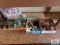 Train track pieces, fence post pieces, lights, and decorative trees.