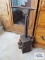 Antique shoe last with accessories mounted to block of wood.