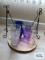 Colored and clear glass vases, plate holders, and wooden serving tray