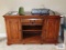 Winners Only oak flat screen TV stand on first floor.