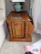 Oak end table with built-in magazine rack on first floor
