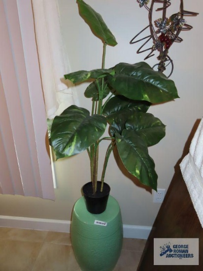 Ceramic plant stand with artificial plant