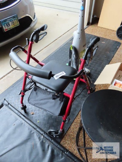Four wheel walker with seat and storage bag
