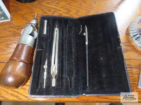 Lockstitch sewing awl by C.A. Myers and part of an antique drafting set.