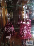 Cranberry hand cut crystal bells. One marked made in Hungary. One needs the clapper reattached.