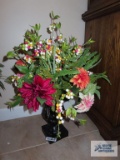 Plastic planter with artificial flowers