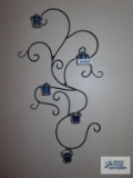 Decorative candle sconce with candles. Bring philips head screwdriver for removal.