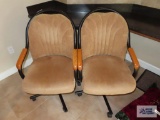 Two roll about dining room chairs