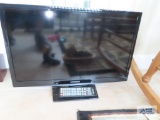 Samsung, model UN24H000, 24 inch flat screen TV with the remote