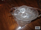 Glass serving dishes with plastic spoons.