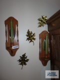 Pair of mirrored wood candle sconces and metal leaf decorations