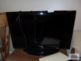 Toshiba 32 inch television model 32C110Uwith wood TV stand.