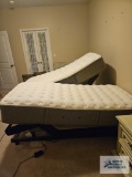 Two Stearns & Foster twin size adjustable beds on Ease by Sealy electric base with two remotes and a