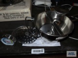 Winco stainless steel foodmill and freezer/refrigerator thermometer.
