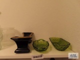 Black with painted gold rim planter and green serving dishes