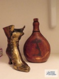 Leather wine decanter made in Brazil and metal shoe decoration.