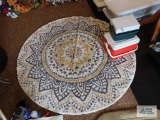 Round area rug, approximately 5 ft