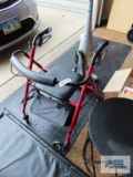 Four wheel walker with seat and storage bag