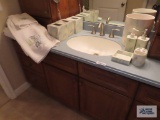 Decorative bathroom items and canvas wall hangings