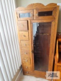 Antique oak sporting cabinet on first floor