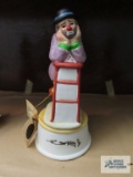 Emmett Kelly Jr, clown with purple coat leaning on stool music box, plays Send in the Clowns,